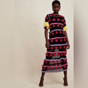 Celia b black crochet with red rosettes